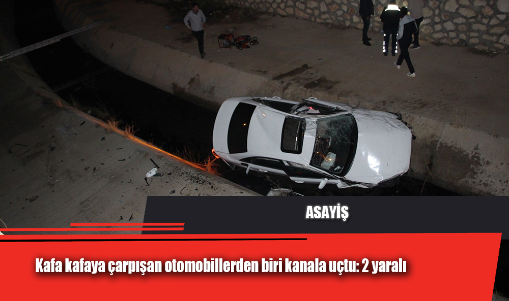 Kafa kafaya çarpışan otomobillerden biri kanala uçtu: 2 yaralı